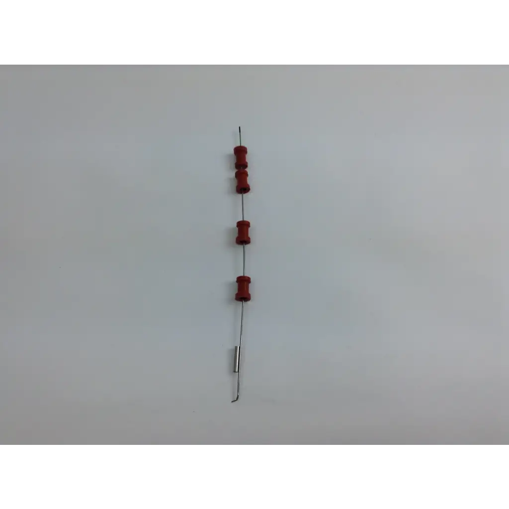 A vertical string of four red cylindrical resistors and one silver resistor in the olympus cystoscopy resection set with aesculap sterilization case