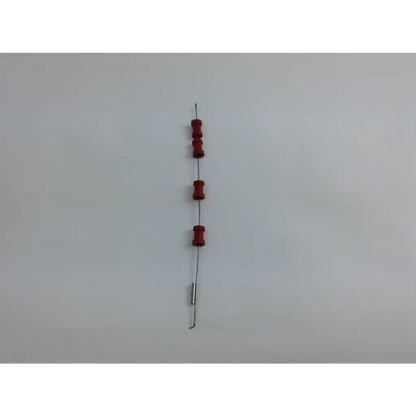 A vertical string of four red cylindrical resistors and one silver resistor in the olympus cystoscopy resection set with aesculap sterilization case