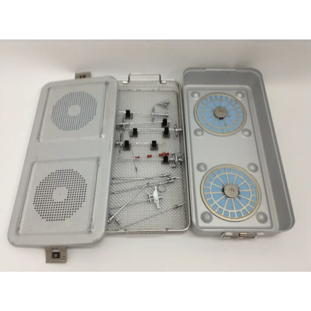 Gray metal surgical instrument tray with mesh interior and blue compartments in olympus cystoscopy resection set aesculap sterilization case