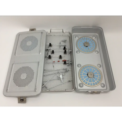 Gray metal surgical instrument tray with mesh interior and blue compartments in olympus cystoscopy resection set aesculap sterilization case