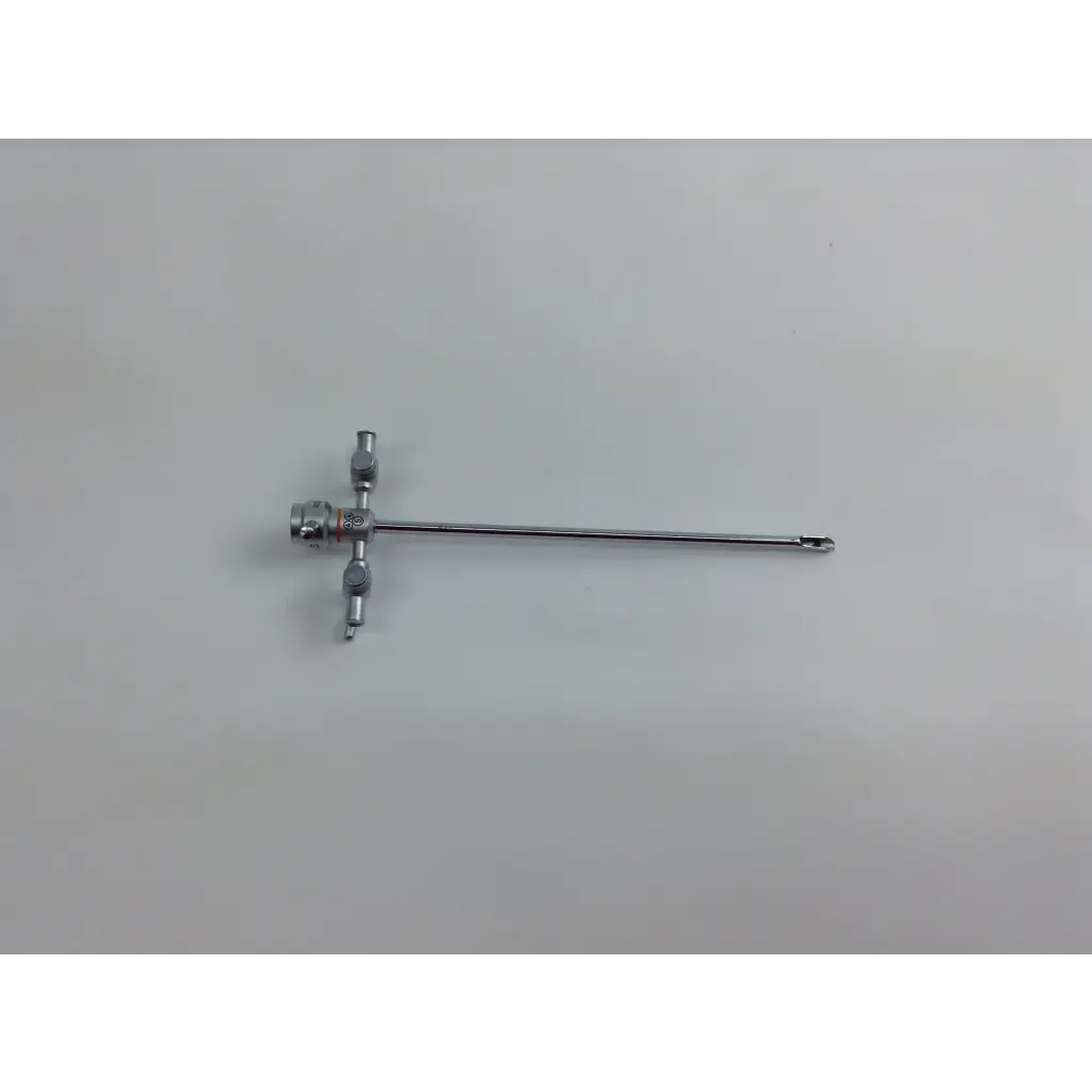 Silver surgical instrument with long slender shaft and three handles from olympus cystoscopy resection set with aesculap sterilization case