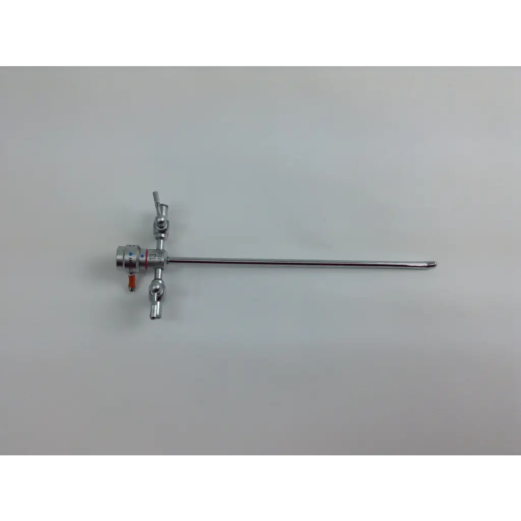Silver olympus cystoscopy resection set instrument with articulated joints in aesculap sterilization case handle end