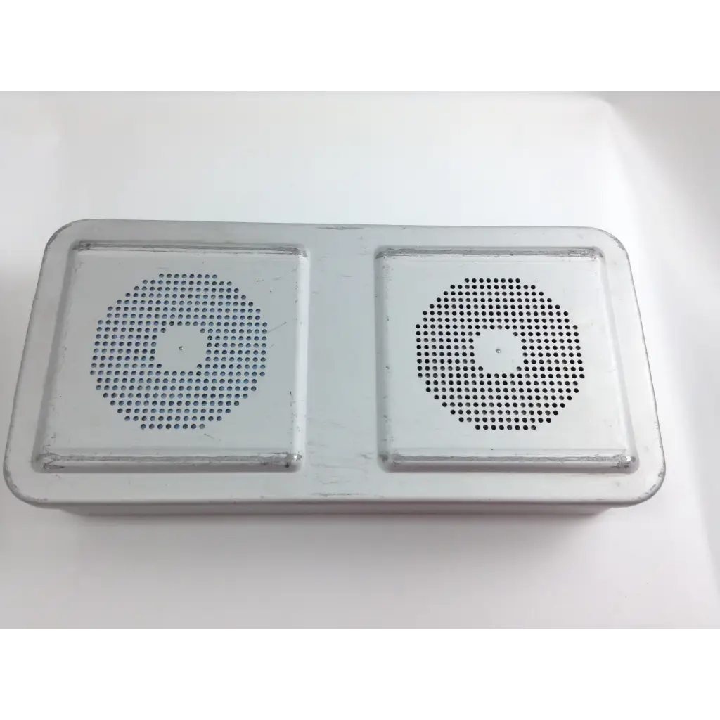 Silver rectangular dual-speaker device with perforated grilles in olympus cystoscopy resection set with aesculap sterilization case