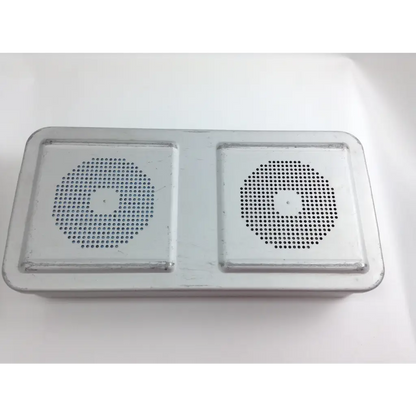 Silver rectangular dual-speaker device with perforated grilles in olympus cystoscopy resection set with aesculap sterilization case