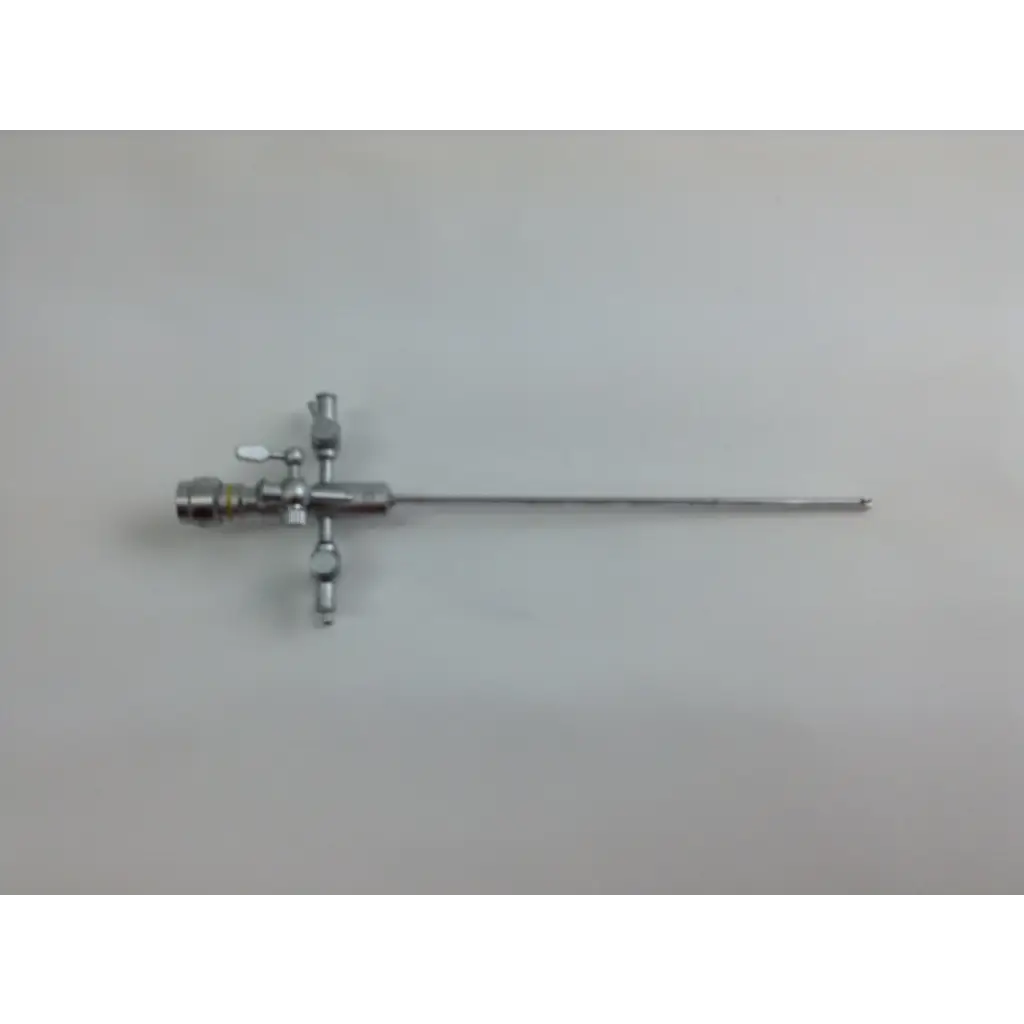 Silver surgical instrument with long slender shaft and articulated joints in olympus cystoscopy resection set with aesculap sterilization case
