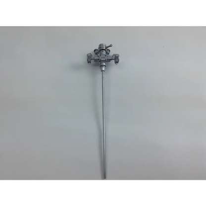 Silver surgical instrument with slender shaft and complex head from olympus cystoscopy resection set in aesculap sterilization case