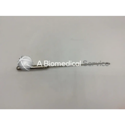 Silver-colored orthopedic systems inc 5451 hand instrument with spherical head and white crosshatch markings