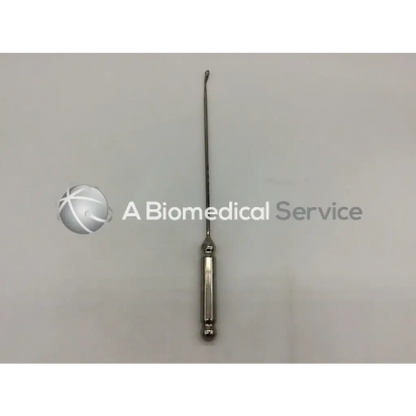 Silver surgical curette with slender curved tip and textured handle orthopedic systems inc 5451 hand instrument ad5-8