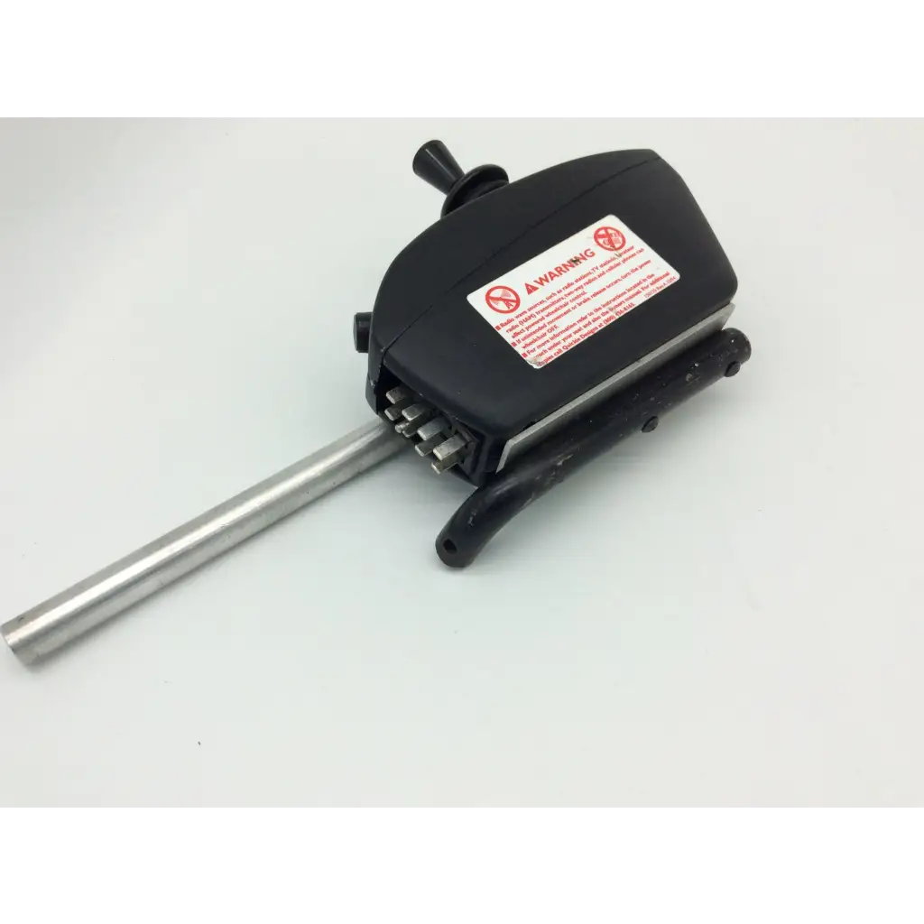 Black plastic handled tool with metallic shaft and bits featuring warning label for pride mobility jet wheelchair pilot joystick d49637