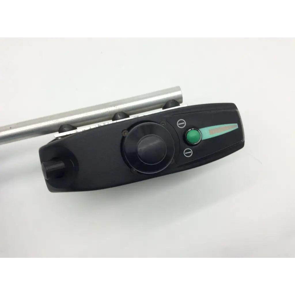 Black plastic control panel with green button and dial and metallic rod on pride mobility jet wheelchair pilot joystick d49637