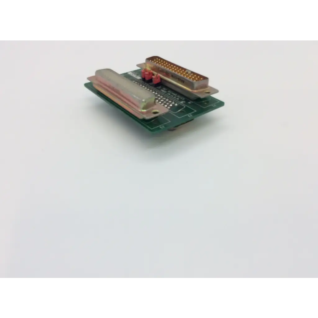 Green pcba adapter dge board with metallic d-sub connector and translucent plastic component by pbt technologies