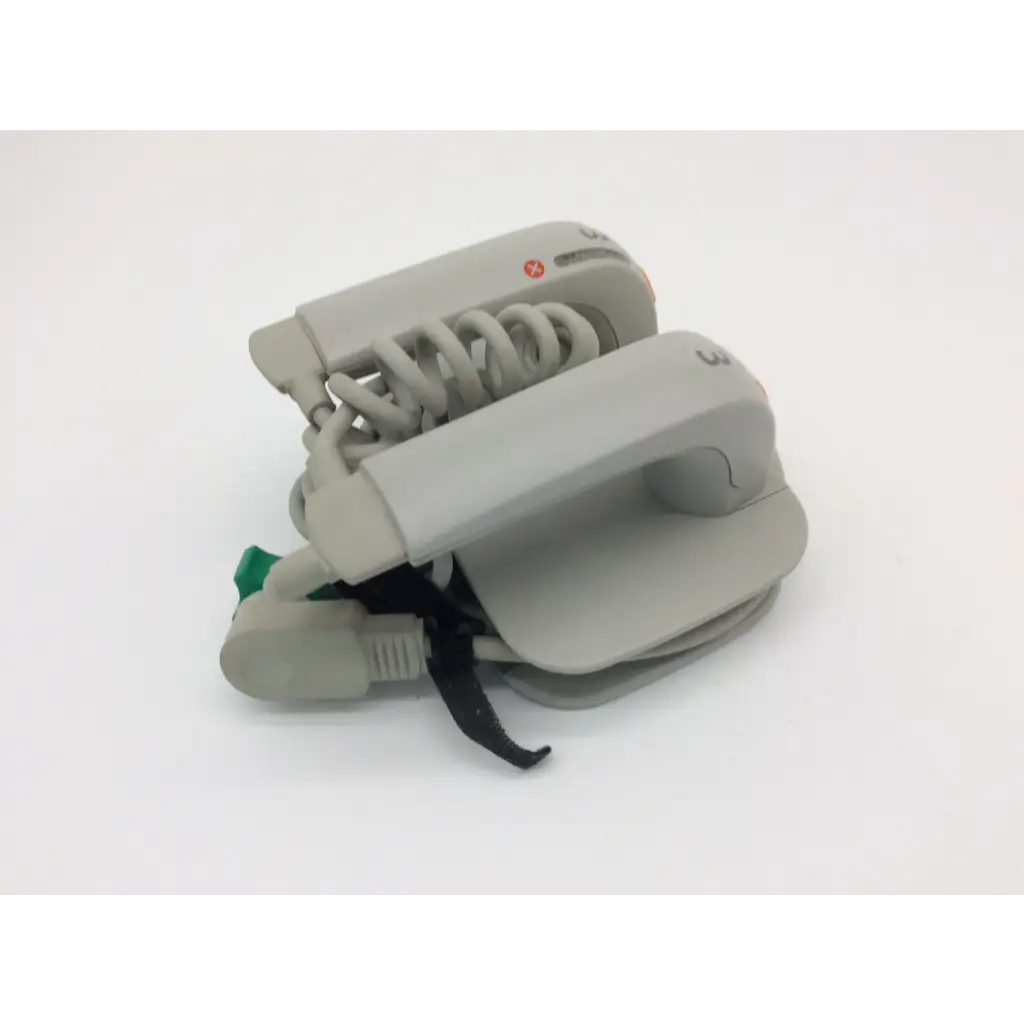 Gray plastic blood pressure monitor with coiled tubing and green button for philips external hard defibrillator m3543a