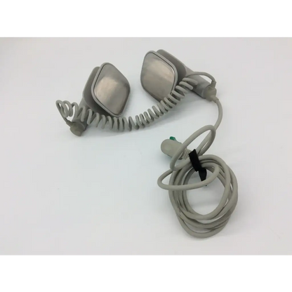 Gray coiled philips external hard defibrillator cable with two metallic rectangular headpiece attachments for m3543a