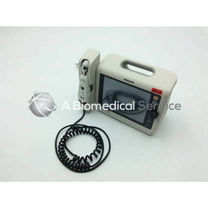Beige philips healthcare suresigns vs4 vital signs monitor with coiled black cable and attached handheld device