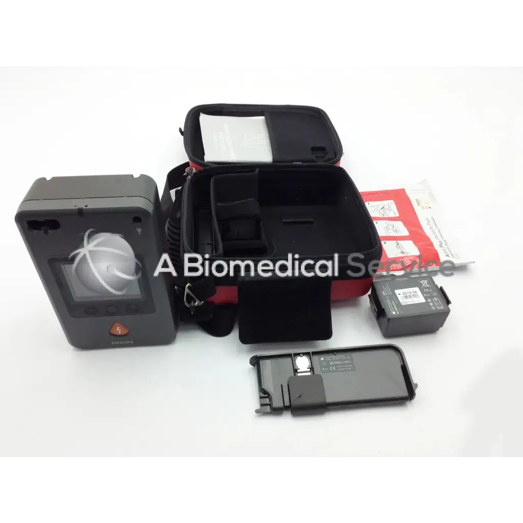 Philips heartstart fr3 aed defibrillator in gray with screen showing anatomical heart and orange button below
