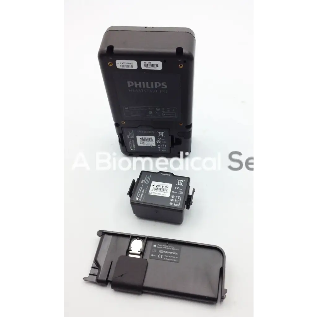 Black philips heartstart fr3 aed defibrillator with rectangular body and attached battery pack for emergency use