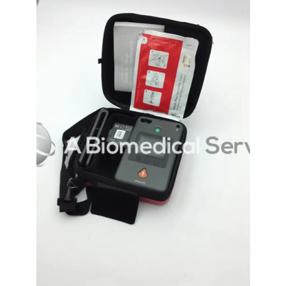 Philips heartstart fr3 aed defibrillator bundle with gray device black carrying case and red instruction packet inside