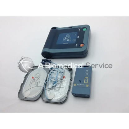 Dark gray philips heartstart frx aed trainer with smart pads battery and electrode pads for emergency use