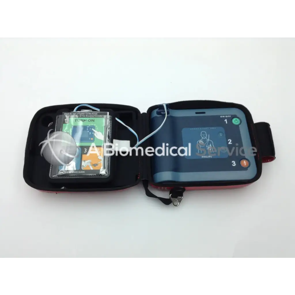 Philips heartstart frx automated external defibrillator in black and red with carrying case pads and instruction manual