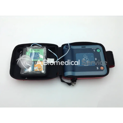 Philips heartstart frx automated external defibrillator in black and red with carrying case pads and instruction manual