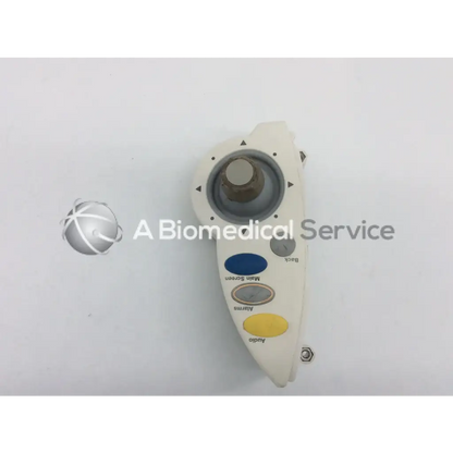 White plastic philips intellivue m4046-61402 patient monitor controller dial assembly with joystick and colored buttons