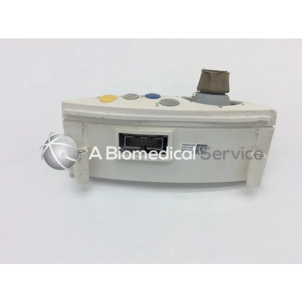 Beige philips intellivue m4046-61402 patient monitor controller with colorful buttons and silver spherical controller dial assembly