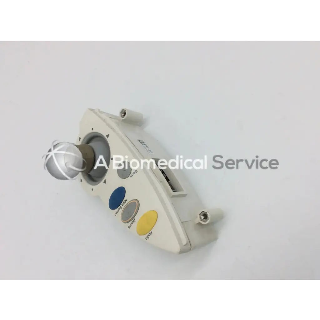 Beige philips intellivue m4046-61402 patient monitor controller with silver ball joystick and blue yellow buttons