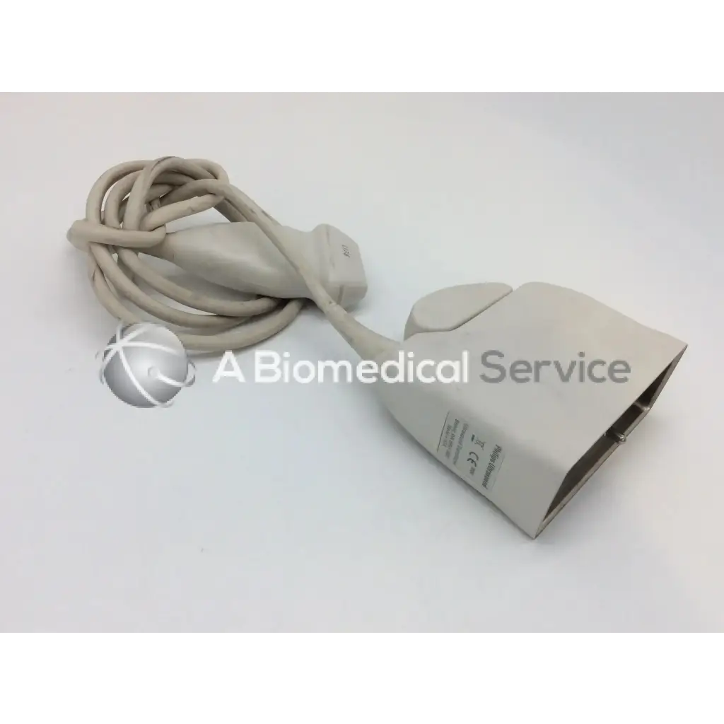 Beige philips l17-5 linear array ultrasound transducer probe with coiled cable and rectangular housing for medical use