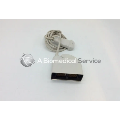 Beige philips l17-5 linear array ultrasound transducer probe with coiled cable and black connector for medical use