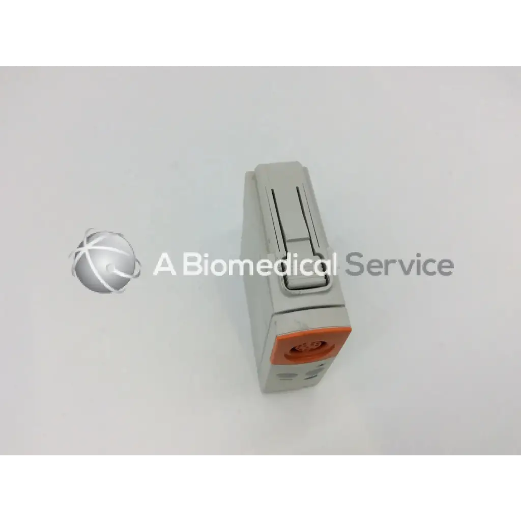 Gray and orange philips m1012a continuous cardiac output monitoring module with rectangular body and sliding latch mechanism