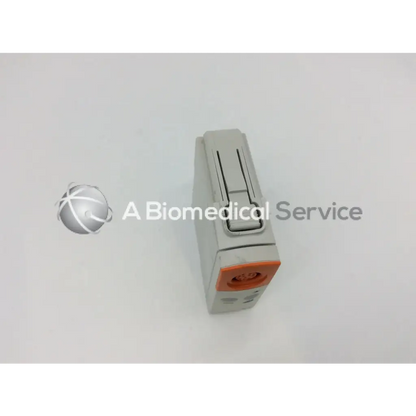 Gray and orange philips m1012a continuous cardiac output monitoring module with rectangular body and sliding latch mechanism