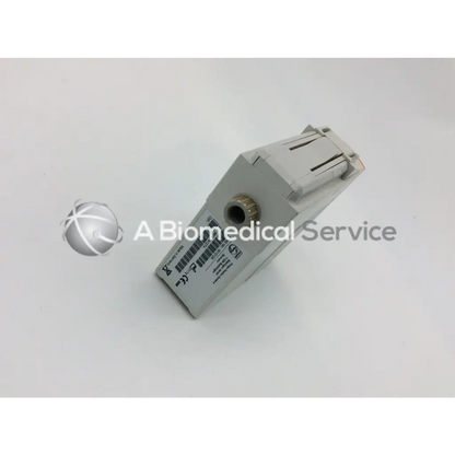 Gray rectangular philips m1012a continuous cardiac output monitoring module with metallic connector and printed labeling