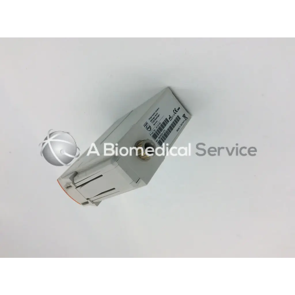 Gray rectangular philips m1012a continuous cardiac output monitoring module picco showing barcode and certification labels on side