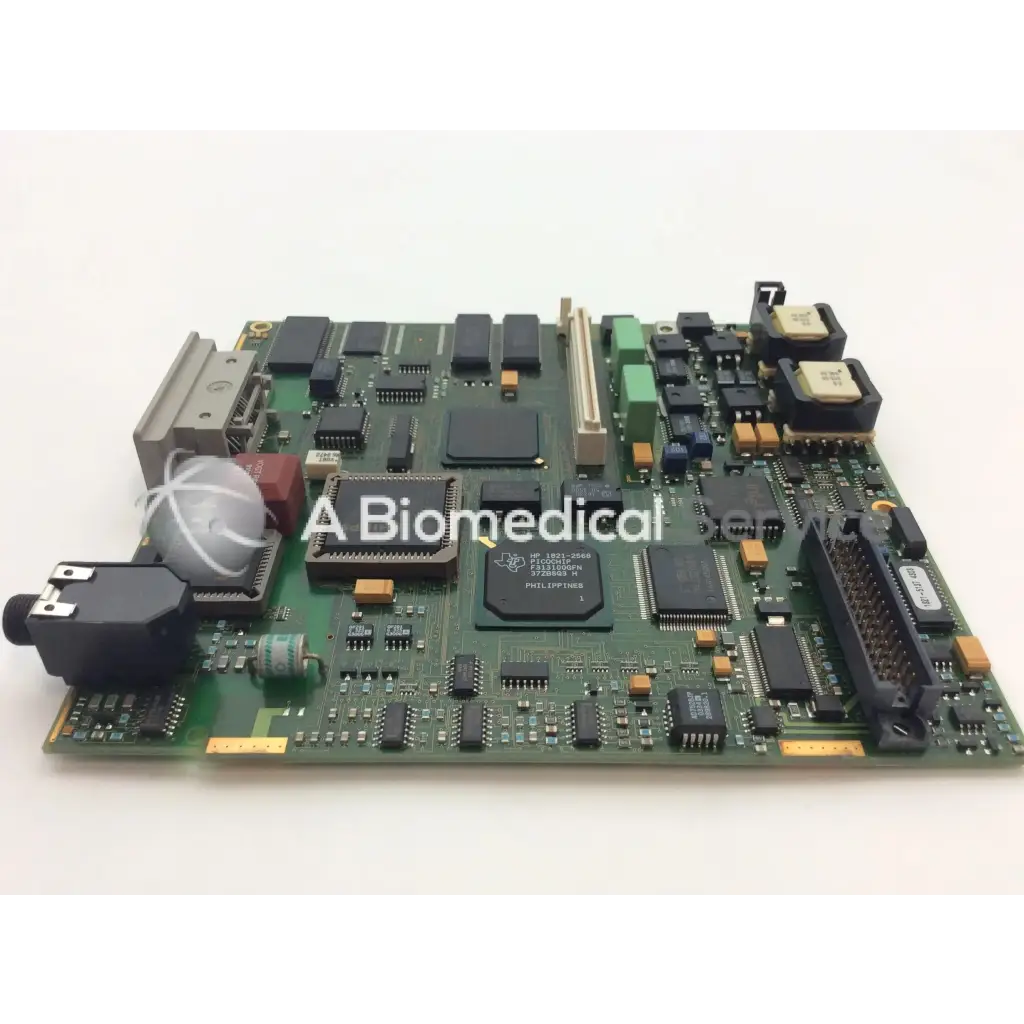 Philips m3046-66402 patient monitor circuit board with green pcb black and orange components and central philipsp chip