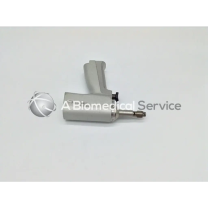 Gray ergonomic handheld stryker system 5 double trigger rotary drill with metallic tip and black adjustment knob