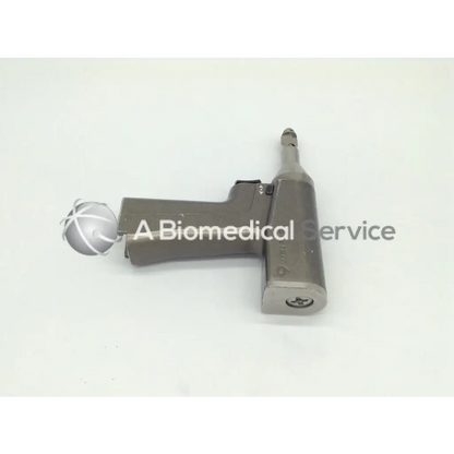 Gray metallic stryker system 6 recip reciprocating saw 6206 with white-tipped spherical surgical drill attachment
