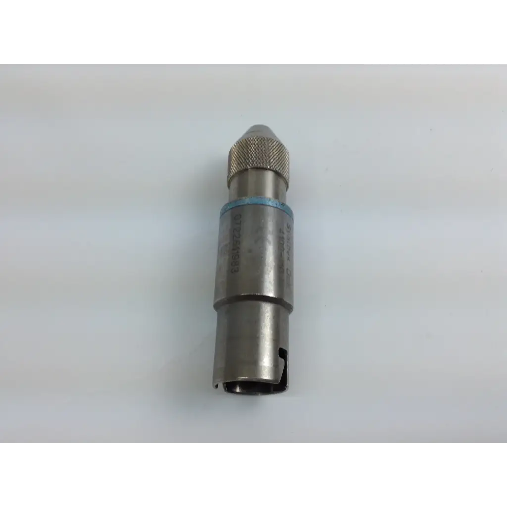 Silver metallic cordless driver with knurled grip and blue rubber band in stryker system 8 driver set aesculap case