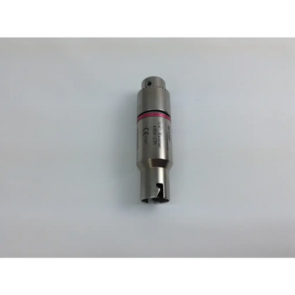 Silver metallic cylindrical sensor with pink band and engraved markings from stryker system 8 cordless driver set with aesculap case