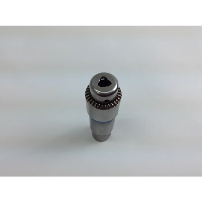 Silver metallic drill chuck with gear-like ridged collar and hexagonal drive in stryker system 8 cordless driver set aesculap case