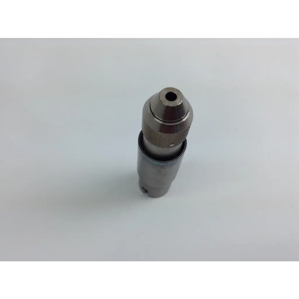 Metal drill chuck with textured grip and central hole for bit insertion in stryker system 8 cordless driver set with aesculap case
