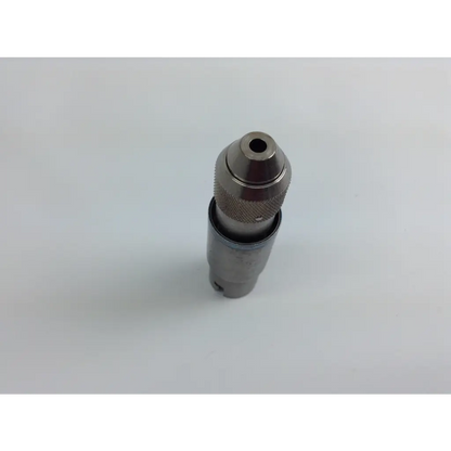 Metal drill chuck with textured grip and central hole for bit insertion in stryker system 8 cordless driver set with aesculap case