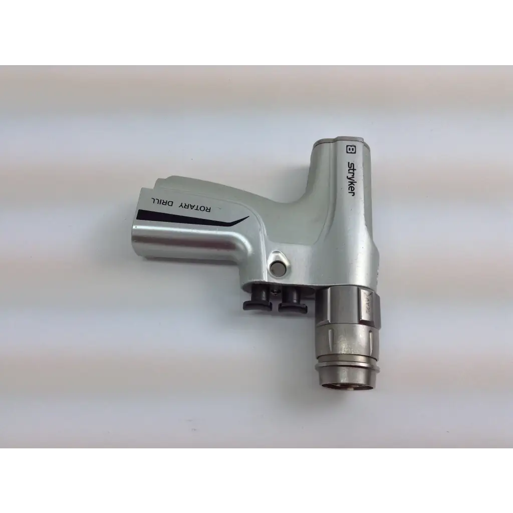 Silver shiyer rotary cordless driver set with black accents in aesculap case for medical and surgical use