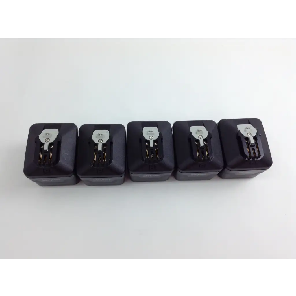 Five black rectangular battery packs with silver connectors for stryker system 8 cordless driver set with aesculap case