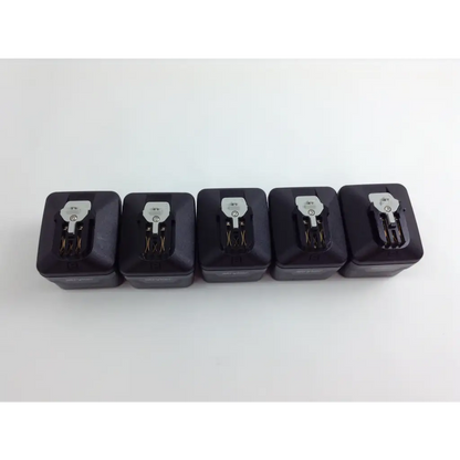 Five black rectangular battery packs with silver connectors for stryker system 8 cordless driver set with aesculap case