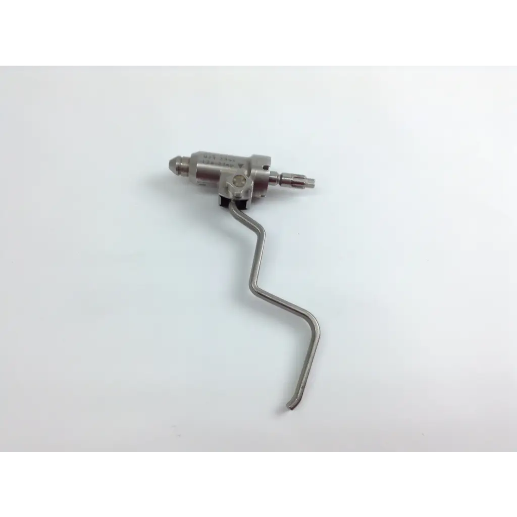 Silver metallic cordless driver with curved handle and multiple connection ports in stryker system 8 cordless driver set aesculap case