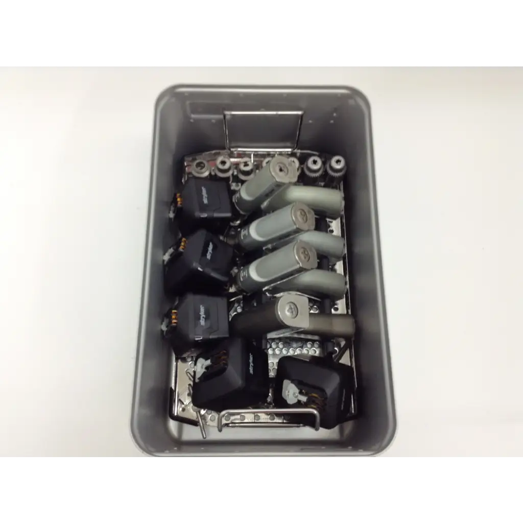 Gray metal tray with mechanical components and black electronic modules for stryker system 8 cordless driver set aesculap case