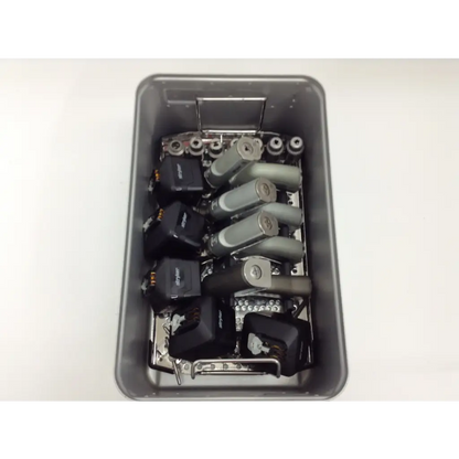 Gray metal tray with mechanical components and black electronic modules for stryker system 8 cordless driver set aesculap case