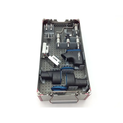Silver and black swiss synthes small battery power drive surgical instrument kit with blue accents in perforated metal tray