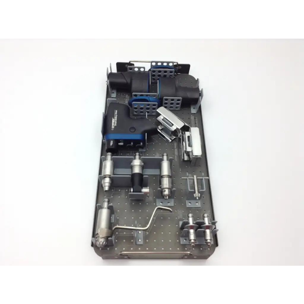 Gray metal surgical instrument tray with black and blue components for swiss synthes small battery power drive set