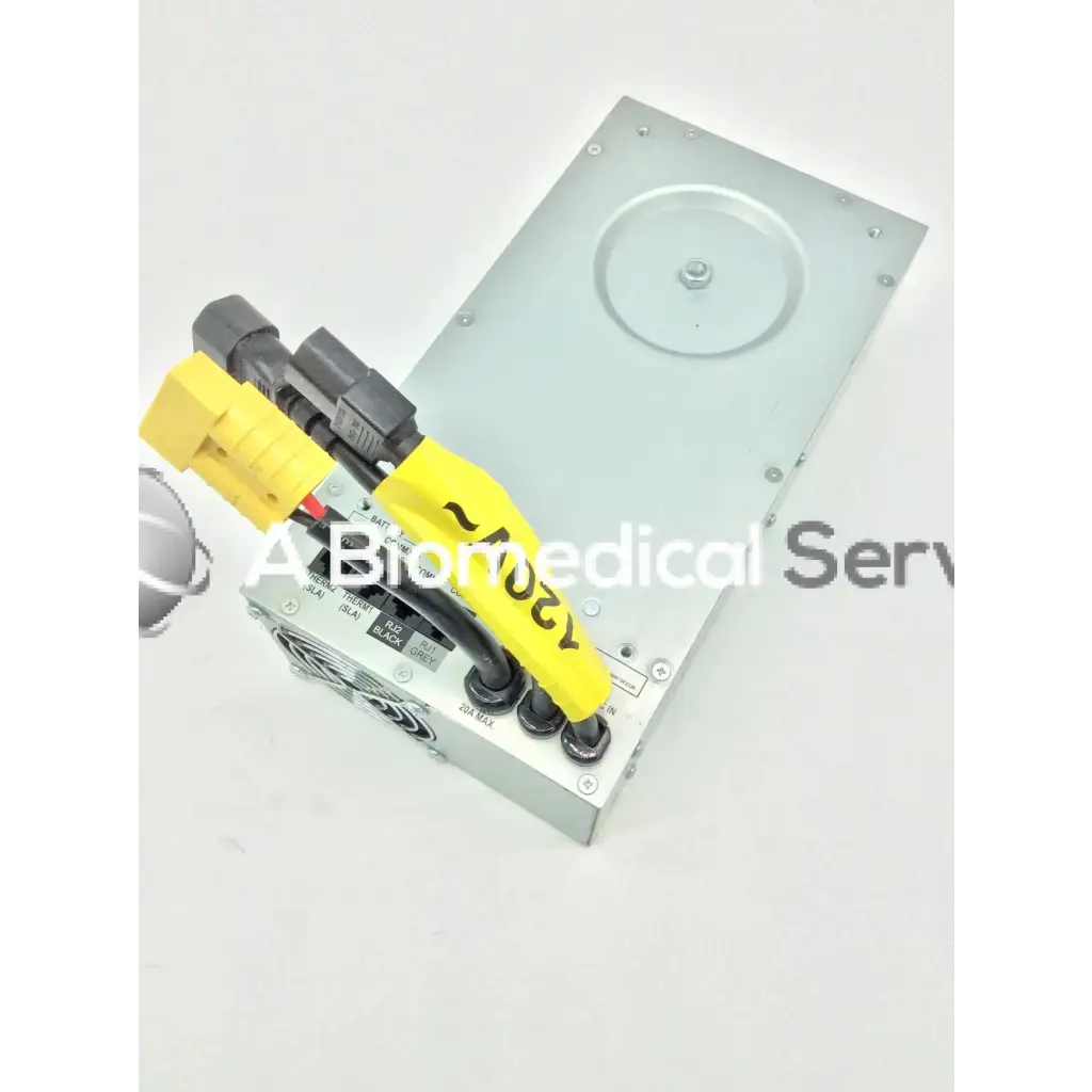 Silver metal tripp lite hc150sl medical cart power supply 150w 120v with yellow and black cables attached